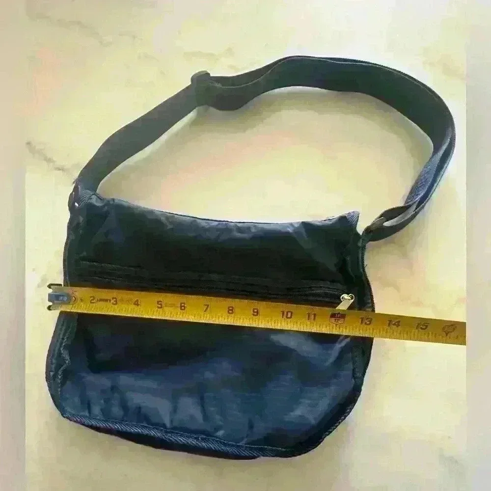 American Tourister dark blue nylon adjustable strap crossbody bag.